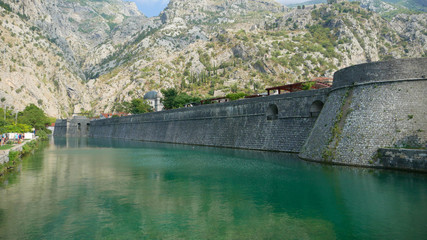 Fototapeta premium The ancient city of Kotor. One of the historic cities of Montenegro with its historic old town, frequent tourist destination, willingly visited by tourists. 