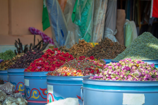 Large iron barrels of blue with dried flowers on the market in the medina of Marrakesh. Africa Morocco