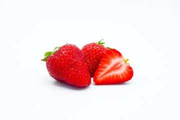 fresh strawberries fruits and a slice isolated on white background