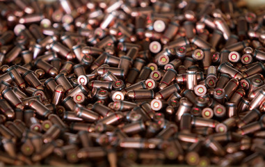 9mm ammo bullets. Military war background. Army supplies. Texture wallpaper.
