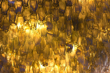 Crystal chandelier radiating yellow light texture background