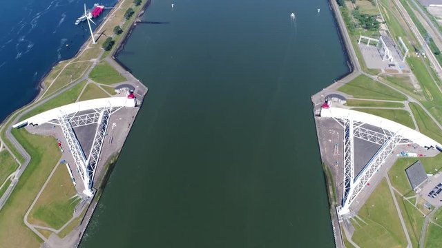 Aerial footage of Maeslantkering storm surge barrier on the Nieuwe Waterweg Netherlands it closes if the city of Rotterdam is threatened by floods and is one of largest moving structures on earth 4k