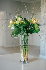 bouquet of flowers on the table, in a vase, light interior