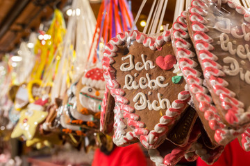 Gingerbread Hearts at German Christmas Market. On traditional ginger bread cookies written "I love you" in German.