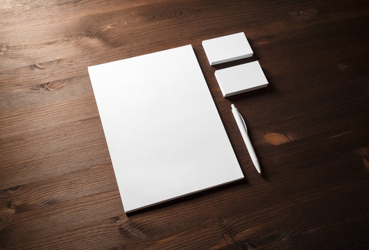 Blank white stationery mock-up. Template for branding identity on wood table background.