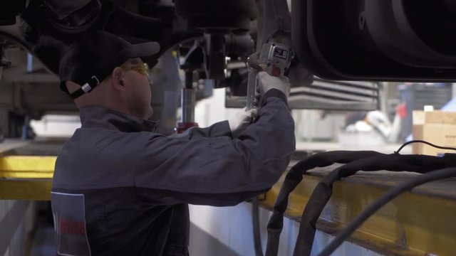 auto mechanic repairs truck suspension