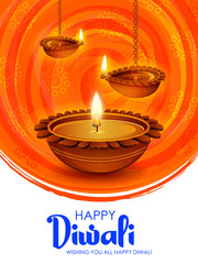 Burning diya on happy Diwali Holiday background for light festival of India