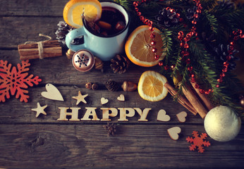 christmas hot mulled wine with cinnamon cardamom and anise on wooden background