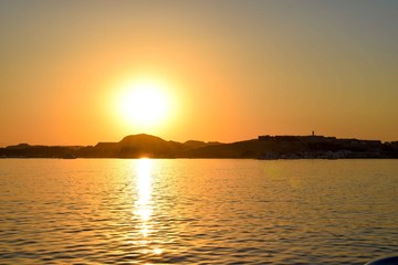 Sunset over hurghada, red sea, Egypt, sunset in front of the ocean over an island