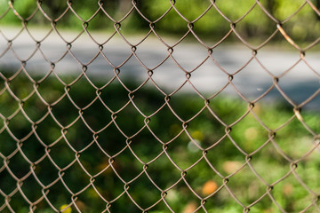 Fototapeta premium Close up of a old metal fence with shallow depth of field