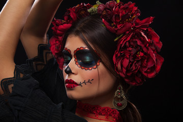 Creative image of Sugar Skull. Neon makeup for Halloween or Dia De Mertos holiday.