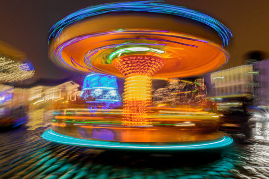 Carousel lights motion in amusement park night