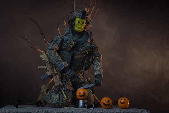 Toy Soldier Wearing Skeleton Mask While Carving A Pumpkin