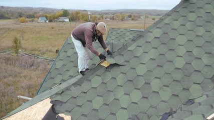 Repair of the roof of a residential building. Dismantling soft tile.