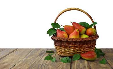 Ripe pears in basket on  wooden background. Isolated on white.