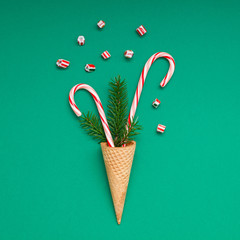 Christmas card with candy canes in waffle cone