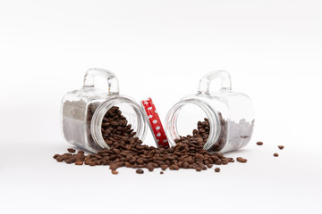 Overturned vintage set of jars full of coffee beans  on a white background with copy space