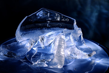 Colorful pieces of ice, painted with light. Still life, abstraction, background, texture