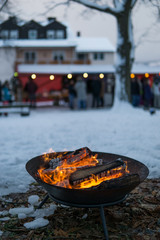 Fire bowl in the winter at a christmas market, Germany.