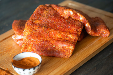 Prepping ribs for dinner with BBQ
