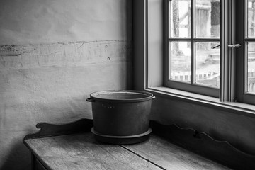 The old cauldron on a table in farmhouse