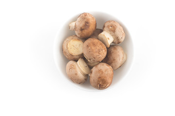 Fototapeta na wymiar Fresh champignon mushrooms in a bowl