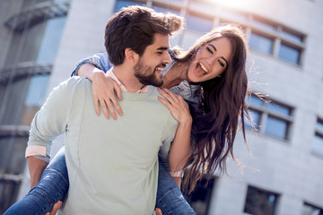 Happy romantic people on street.