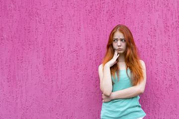 Obraz na płótnie Canvas Confused red hair girl
