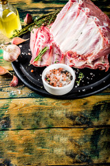Raw meat, pork ribs with herbs and spices 