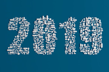 Silhouettes text 2019 with pills on a blue uniform background 3d illustration