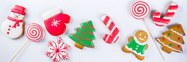 Various traditional colorful sugar glazed christmas gingerbread cookies, on white background top...