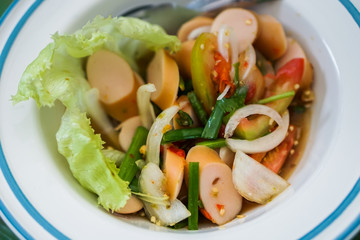 Sausage spicy salad in a bowl.