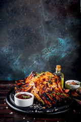 Grilled meat concept. bbq pork ribs with barbeque sauce, olive oil. fresh herbs copy space - obrazy, fototapety, plakaty