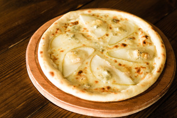 delicious pizza with meat, cheese and mushrooms	