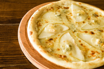 delicious pizza with meat, cheese and mushrooms	