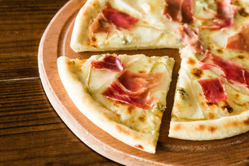 delicious pizza with meat, cheese and mushrooms	