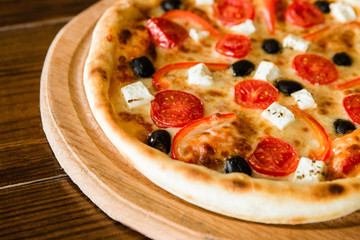 delicious pizza with meat, cheese and mushrooms	