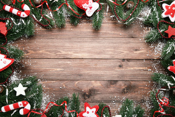 Christmas decorations with white snow on wooden table