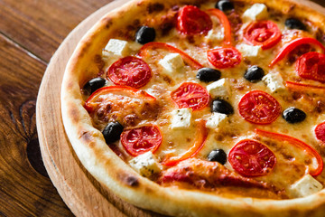 delicious pizza with meat, cheese and mushrooms	
