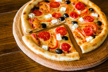 delicious pizza with meat, cheese and mushrooms	