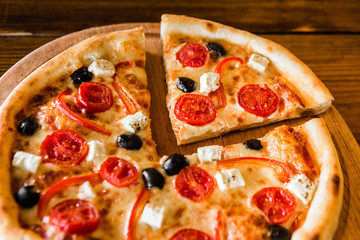 delicious pizza with meat, cheese and mushrooms	