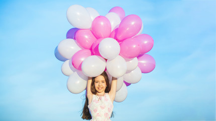 Little girl with balloons. Summer holidays, celebration, children happy little girl with colorful balloons. Portrait of a happy teenager or preteen. Child's birthday party, celebrate, holiday.