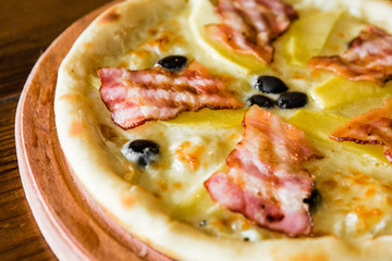 delicious pizza with meat, cheese and mushrooms	