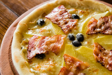 delicious pizza with meat, cheese and mushrooms	