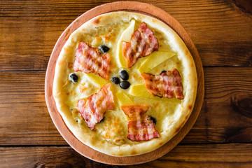 delicious pizza with meat, cheese and mushrooms	