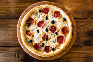 delicious pizza with meat, cheese and mushrooms	