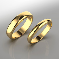 Golden wedding jewellery rings on gradient background. 3d render.