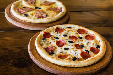 delicious pizza with meat, cheese and mushrooms	