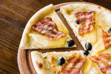 delicious pizza with meat, cheese and mushrooms	