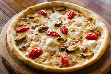 delicious pizza with meat, cheese and mushrooms	
